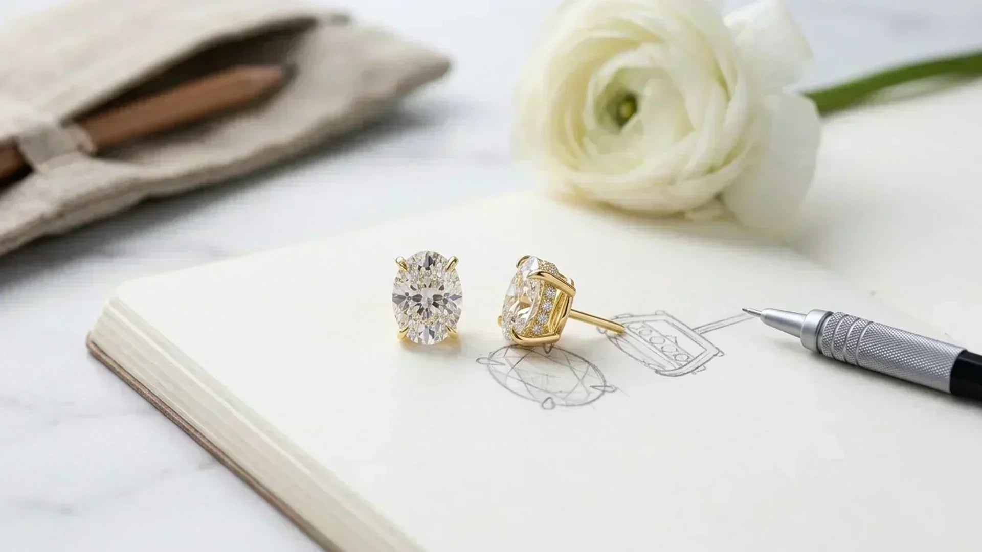 Oval hidden halo diamond studs on sketchbook custom design 