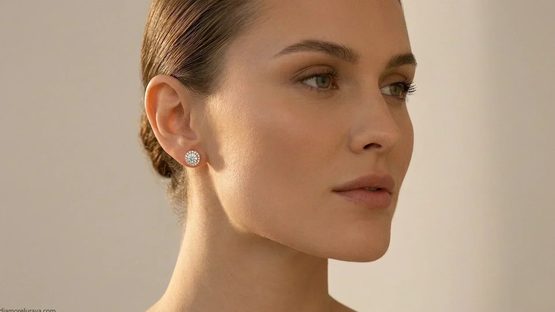 Round halo lab-grown diamond earrings on a woman with a square face 