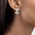 Rose gold diamond floral earrings worn on ear close-up, elegant pear shaped cluster bow on model, trendy rose gold lab diamond jewelry