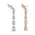 Rose gold diamond linear studs worn on ear, sparkling pear and round cluster cascade close-up, stylish rose gold climber diamond earrings for women