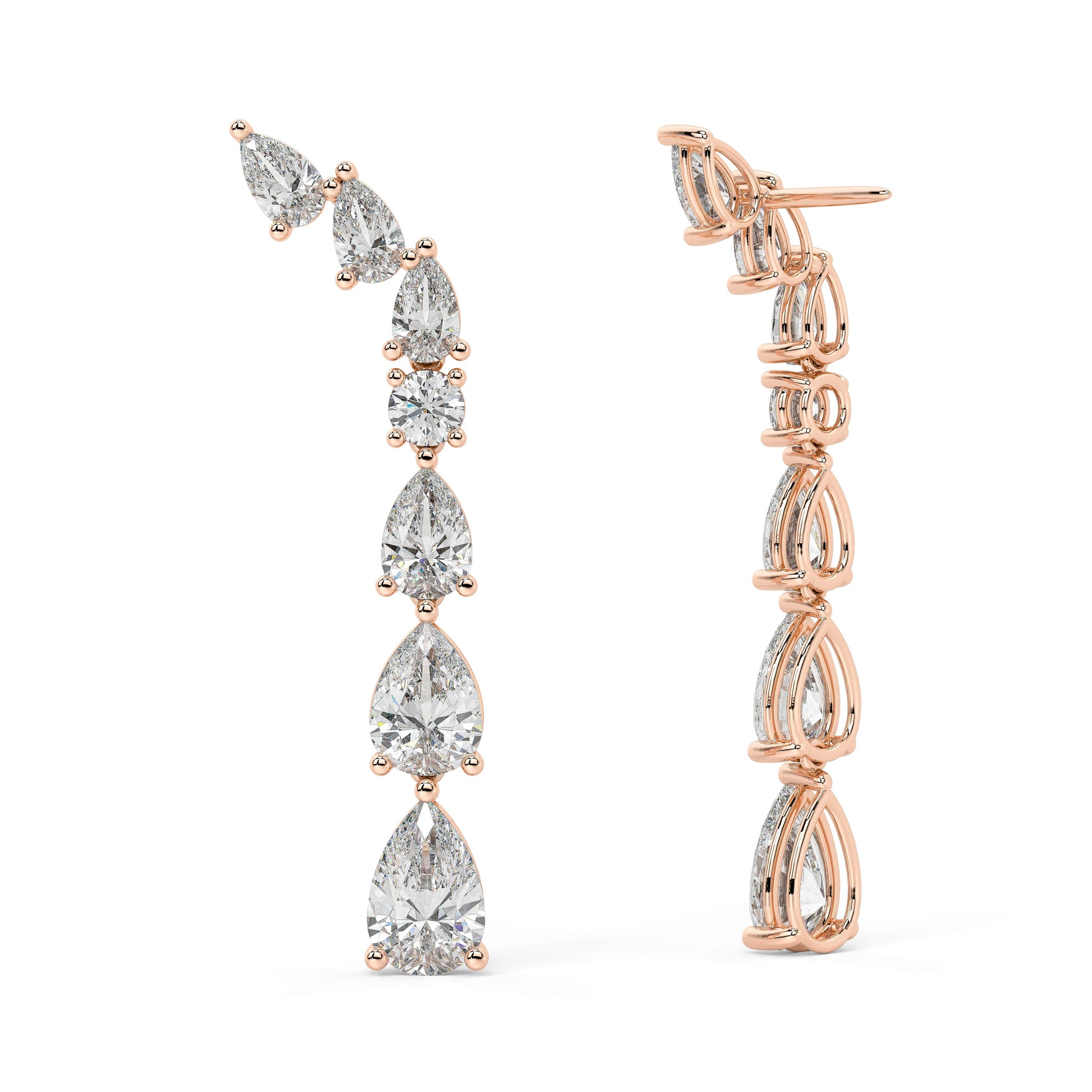Rose gold diamond linear studs worn on ear, sparkling pear and round cluster cascade close-up, stylish rose gold climber diamond earrings for women