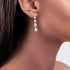 Rose gold diamond climber earrings worn on ear close-up, elegant pear shaped vine cascade on model, trendy rose gold lab diamond jewelry