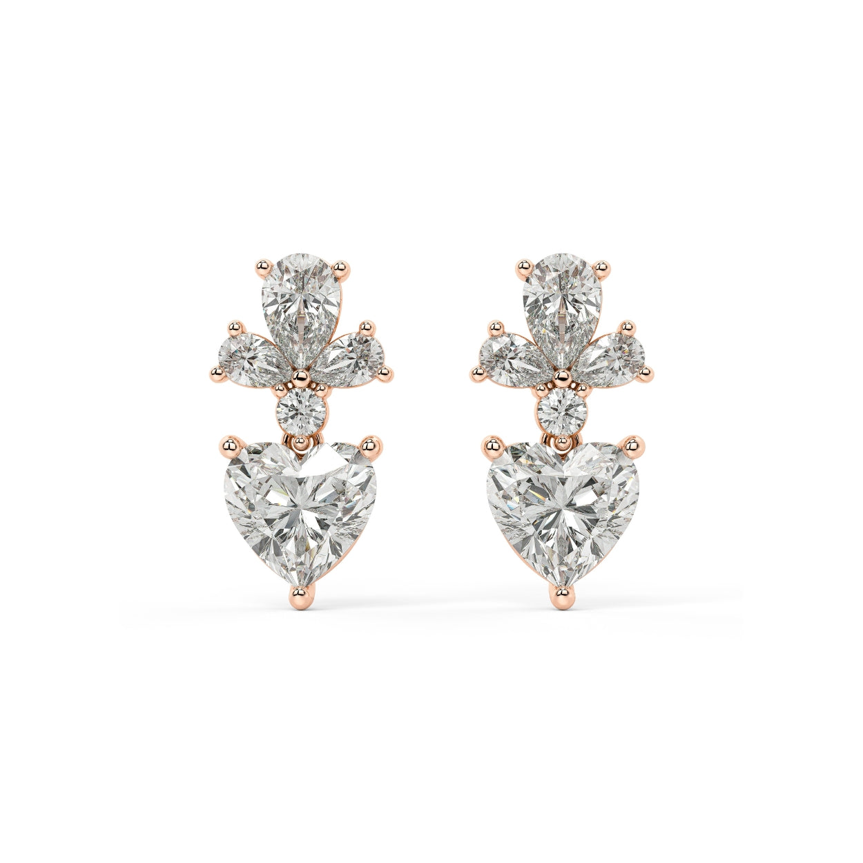 Pair of Diamore Earrings in rose gold with fancy yellow heart diamond hanging below white floral cluster for radiant sculptural piece blending sentimental warmth with modern edge on white background.