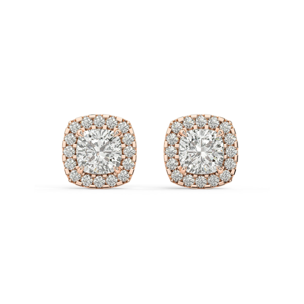 Pair of Cushion Halo lab grown diamond earrings in rose gold with cushion cut ramped up by halo for cozy inviting reflections and nostalgic modern radiance on white background.