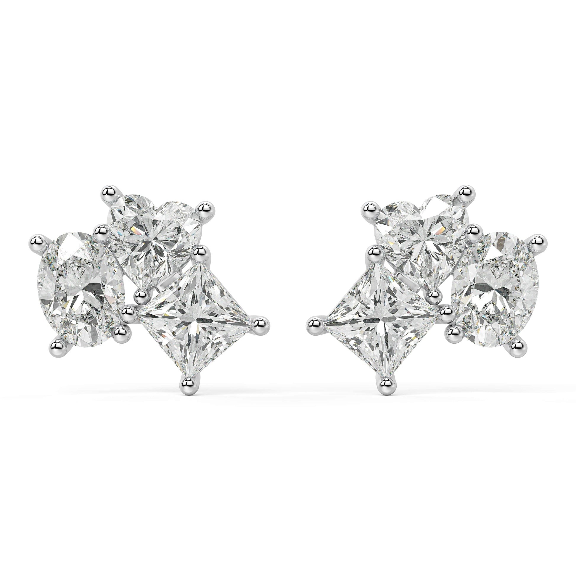 Angled perspective of white gold lab-grown diamond oval and pear drop earrings with radiant cluster design, pair displayed, elegant bridal diamond jewelry