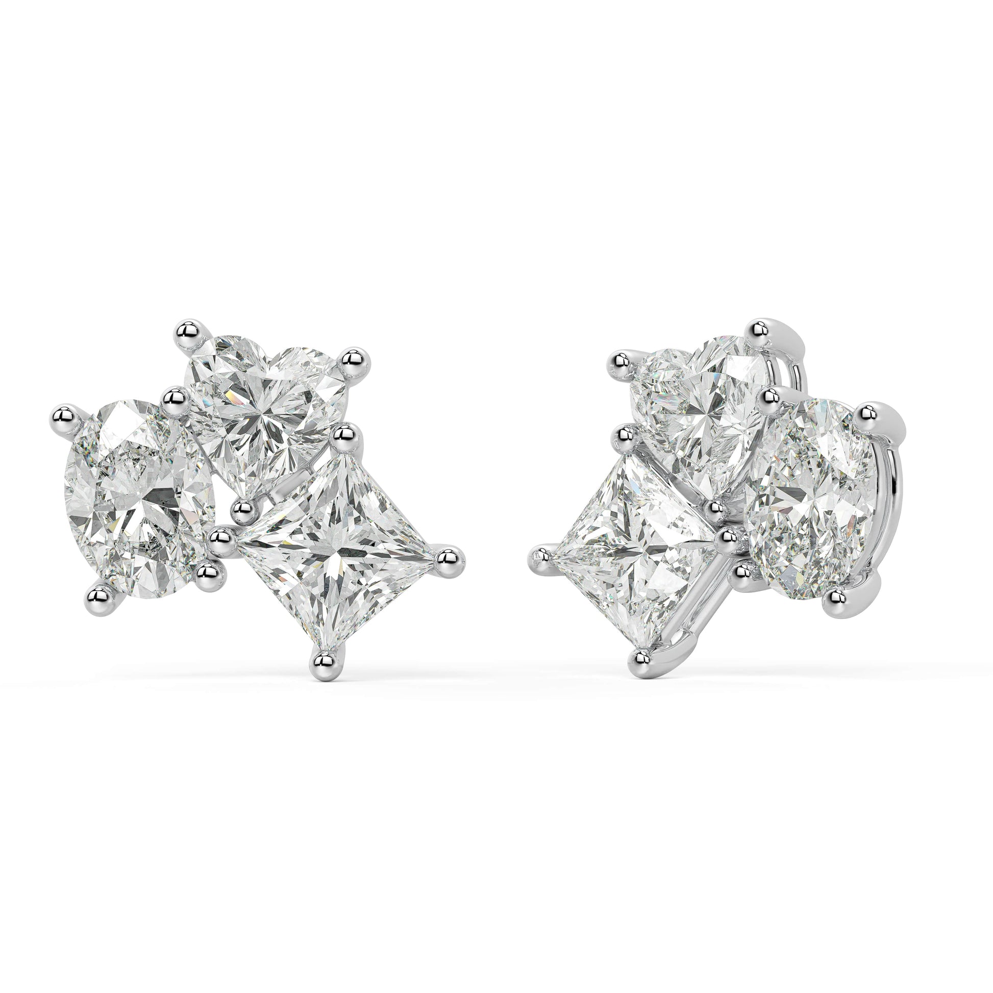 Side view of white gold lab-grown diamond drop earrings highlighting secure post and intricate prong settings on central oval and pear stones, high-end craftsmanship