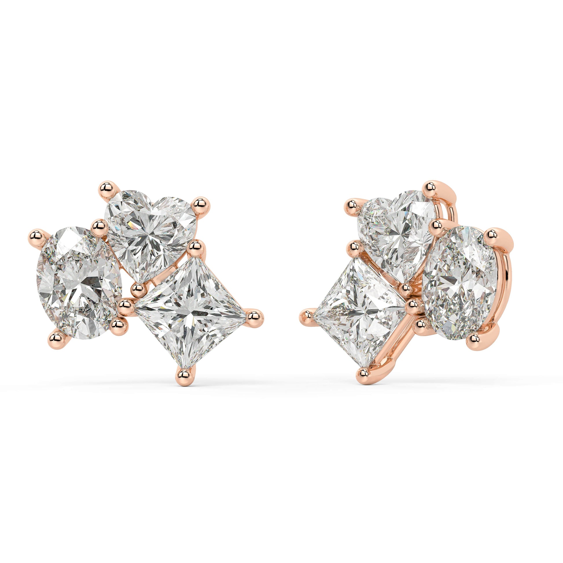 Side profile of rose gold lab-grown diamond drop earrings showing post and elaborate prong settings on oval-cut center and pear stones, exquisite diamond detail