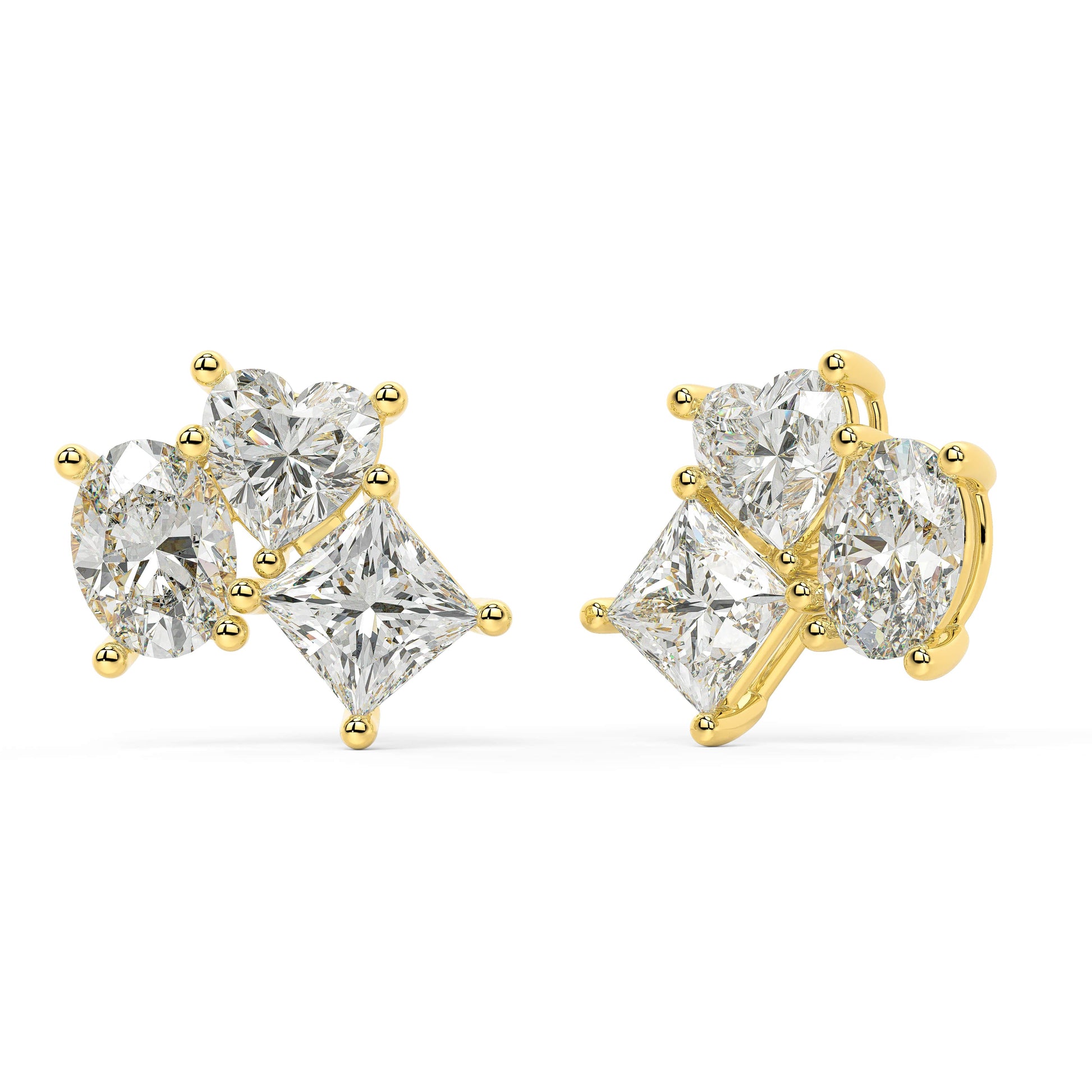 Angled view of yellow gold lab-grown diamond cluster drop earrings featuring oval middle stone and pear side diamonds, pair shown, high-end luxury jewelry