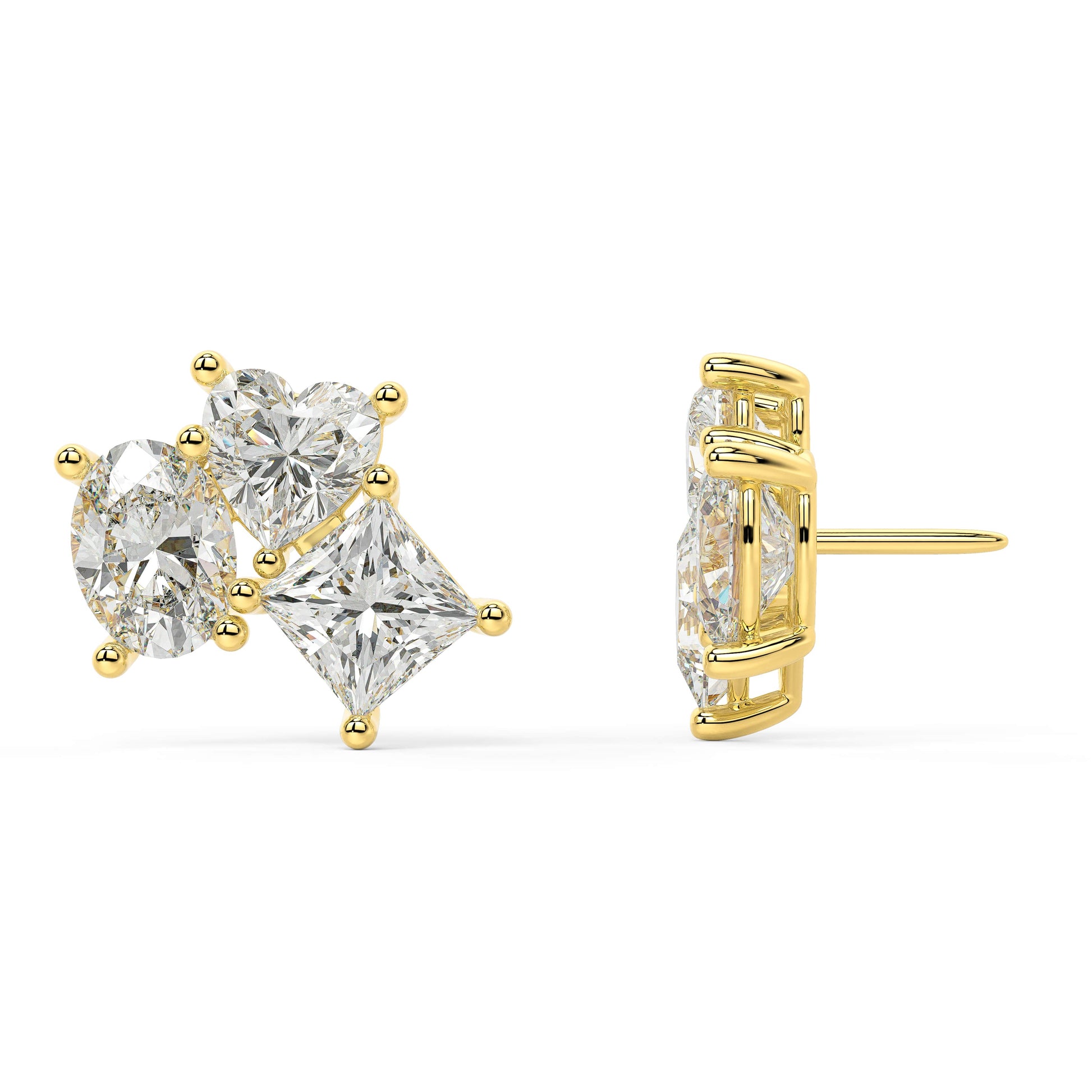 Side profile of yellow gold lab-grown diamond three-stone earrings displaying post backing and detailed prong settings on oval and pear diamonds, fine diamond craftsmanship