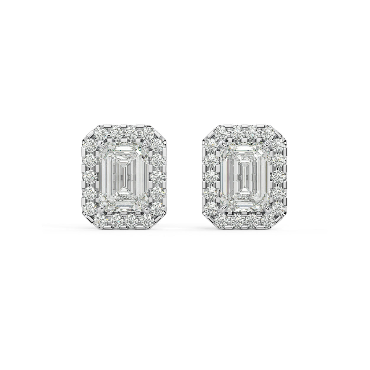 Pair of Emerald Halo lab grown diamond earrings in white gold featuring emerald core in delicate halo balancing vintage poise with modern edge for graceful drama on white background.