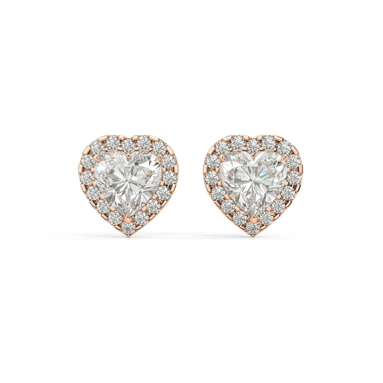 Pair of Heart Halo lab grown diamond earrings in rose gold with heart center embraced by subtle halo for tender yet powerful shine on white background.