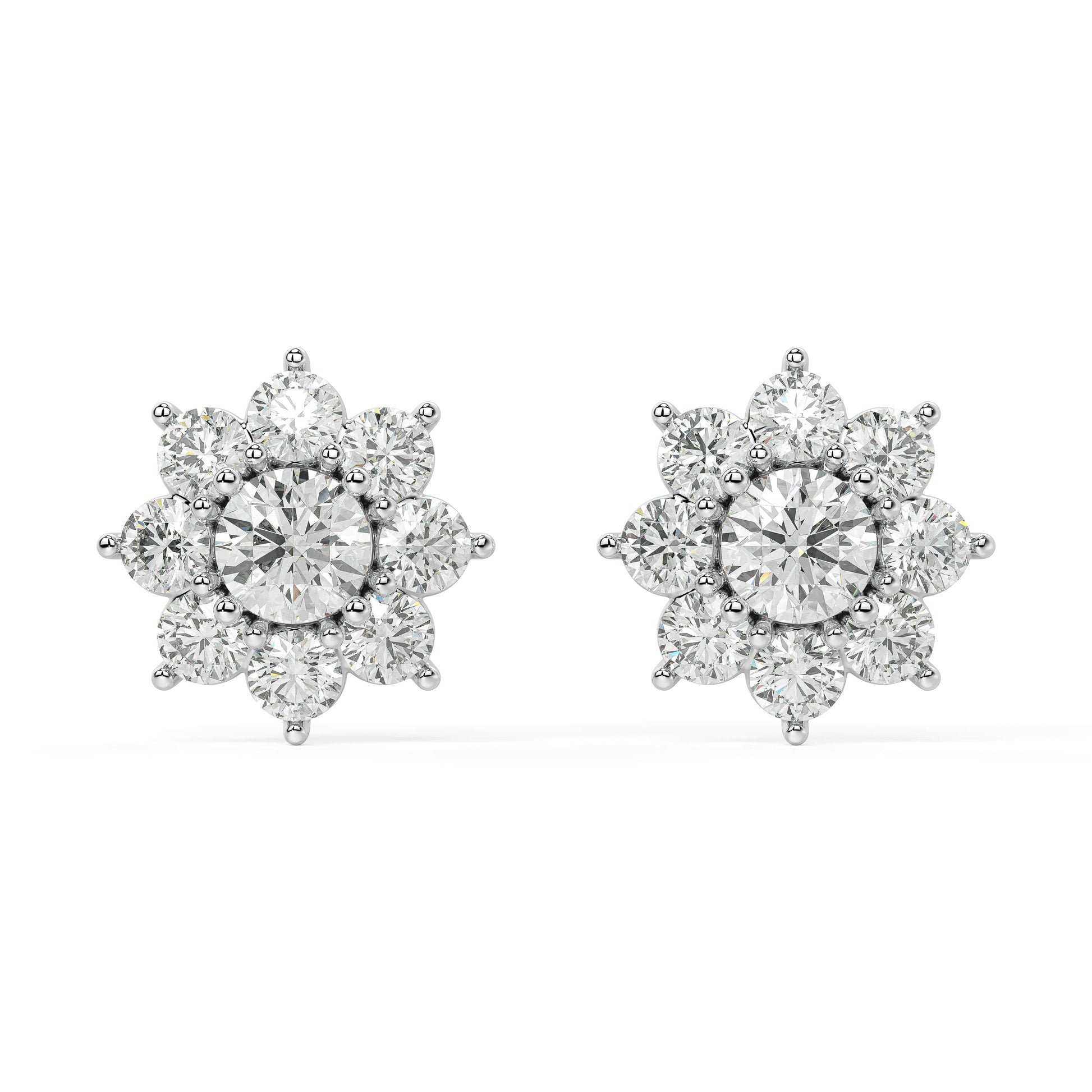 Angled perspective of white gold lab-grown diamond flower cluster earrings with sparkling round center and petal accents, pair displayed, elegant bridal diamond jewelry