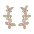 Angled shot of rose gold lab-grown diamond vine cluster earrings featuring marquise petals and pear brilliants in floral arrangement, pair illustrated, trendy diamond earrings