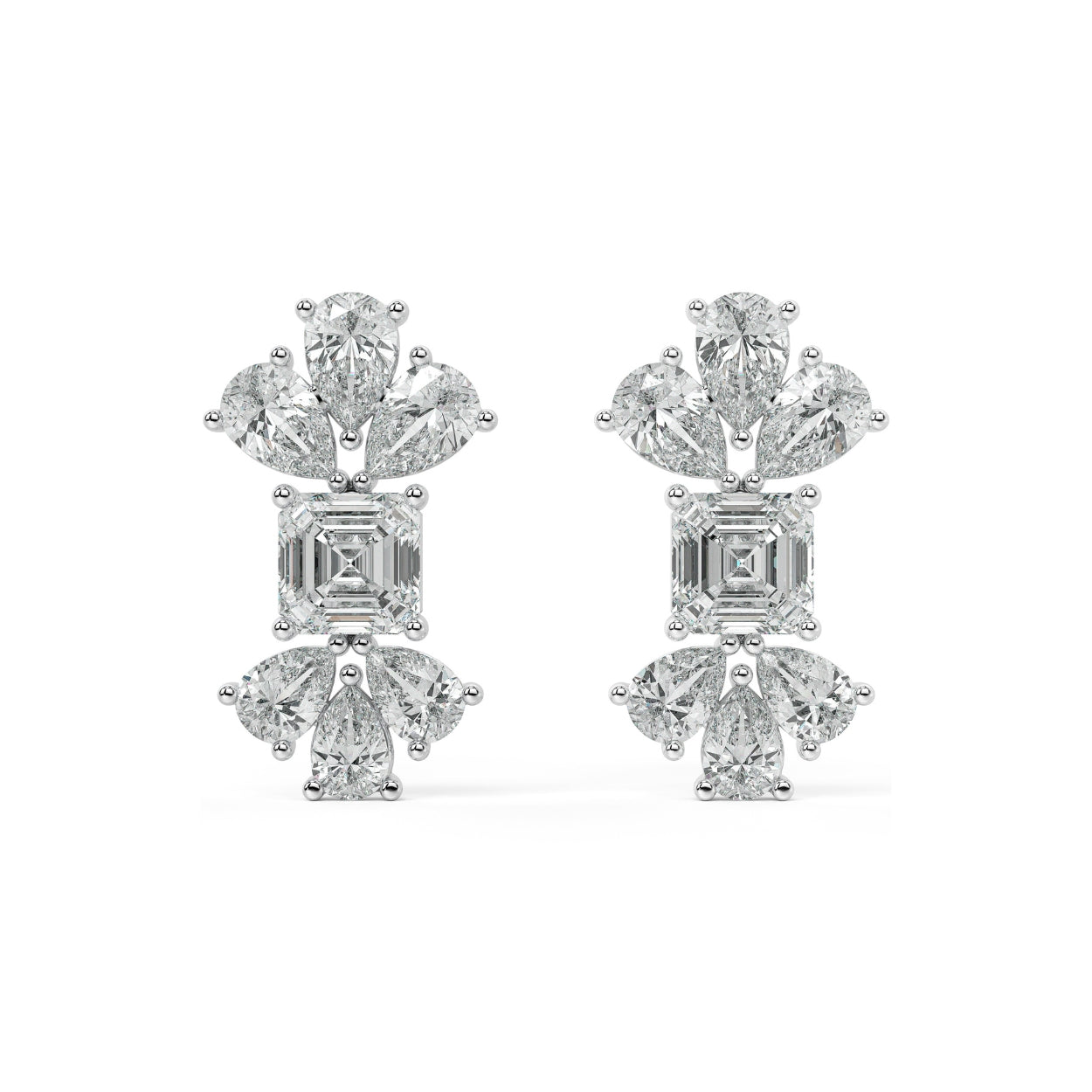 Angled perspective of white gold lab-grown diamond floral cluster earrings with emerald center and sparkling pear diamonds, pair displayed, elegant bridal diamond studs