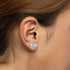 Model wearing Sorelle Studs lab grown double diamond earrings in white gold on ear, capturing the modern edge that elevates any look with snag-free design and net-zero emissions.