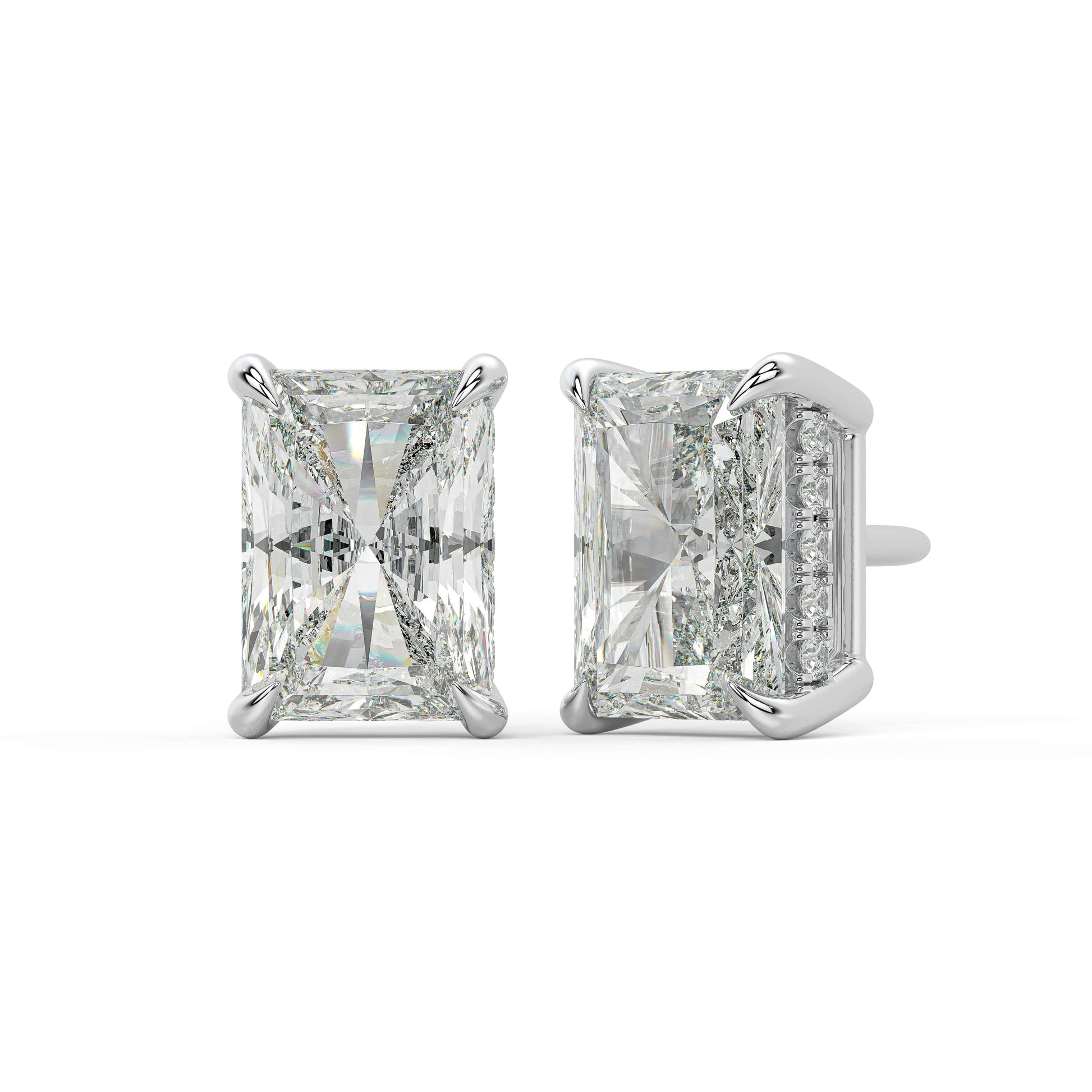 Angled view of white gold Radiant Hidden Halo earrings showing sleek four prong and hidden pave for VS plus clarity DEF color exceptional fire.