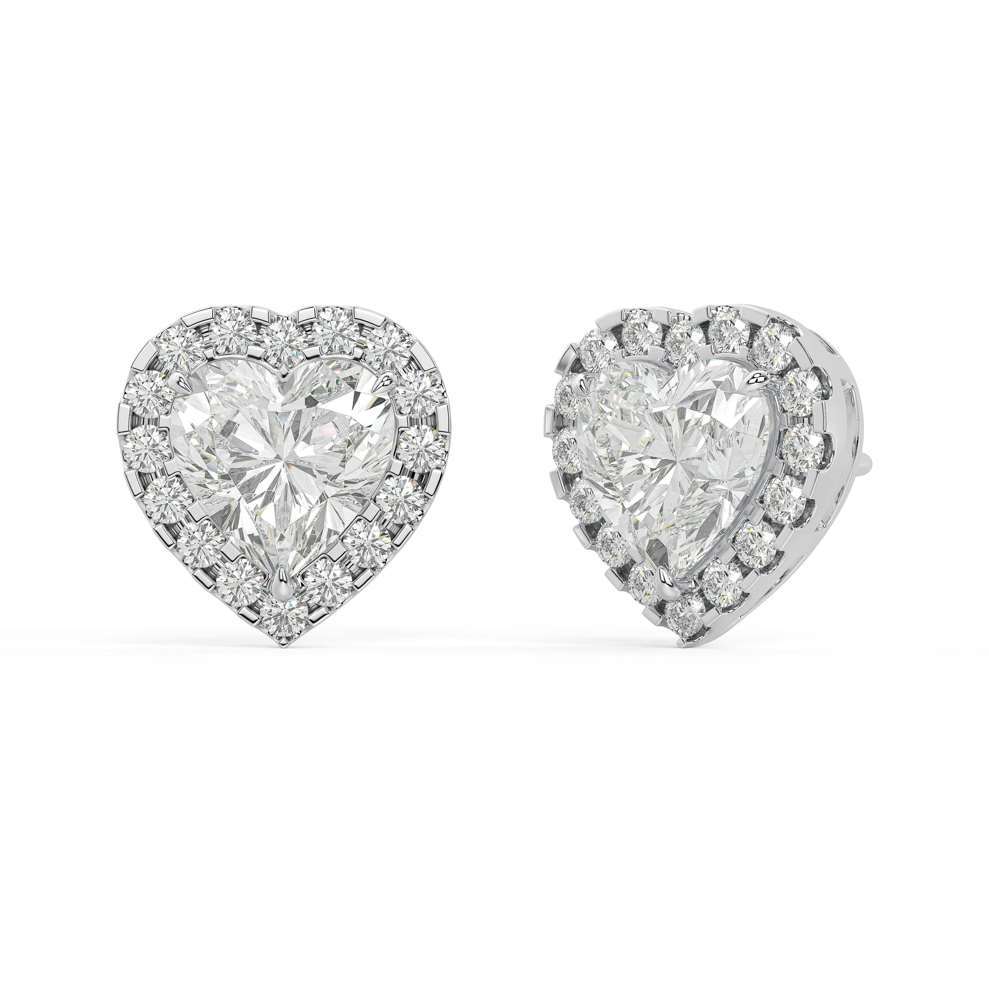 Angled view of white gold Heart Halo earrings showing prong hold and subtle halo with 2.39 CTW 34 lab grown diamonds zero emission methods superior VS plus clarity DEF color.