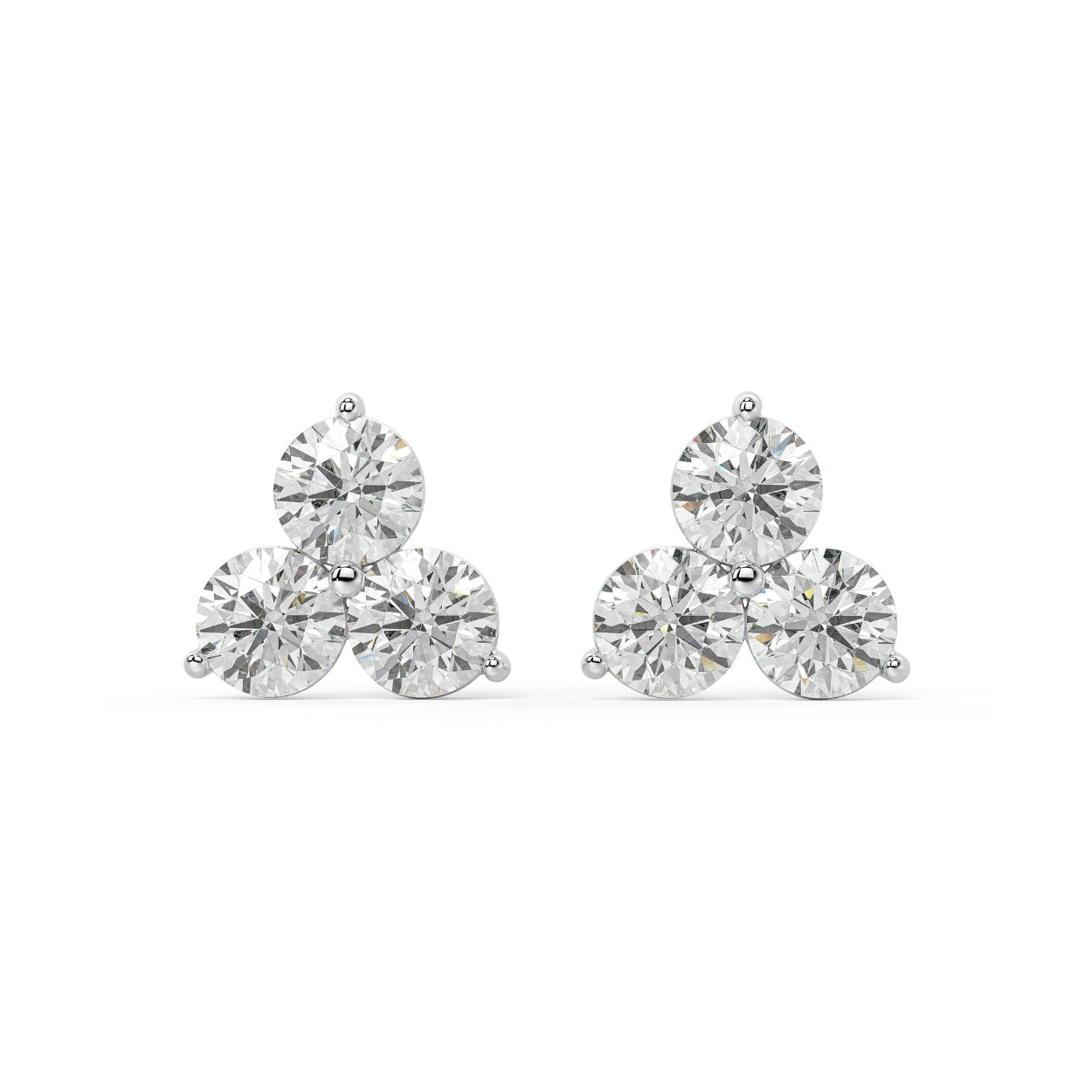 Pair of Trinity Studs lab grown diamond earrings in white gold, three round brilliant stones in classic triple setup on white background, elevating everyday looks.