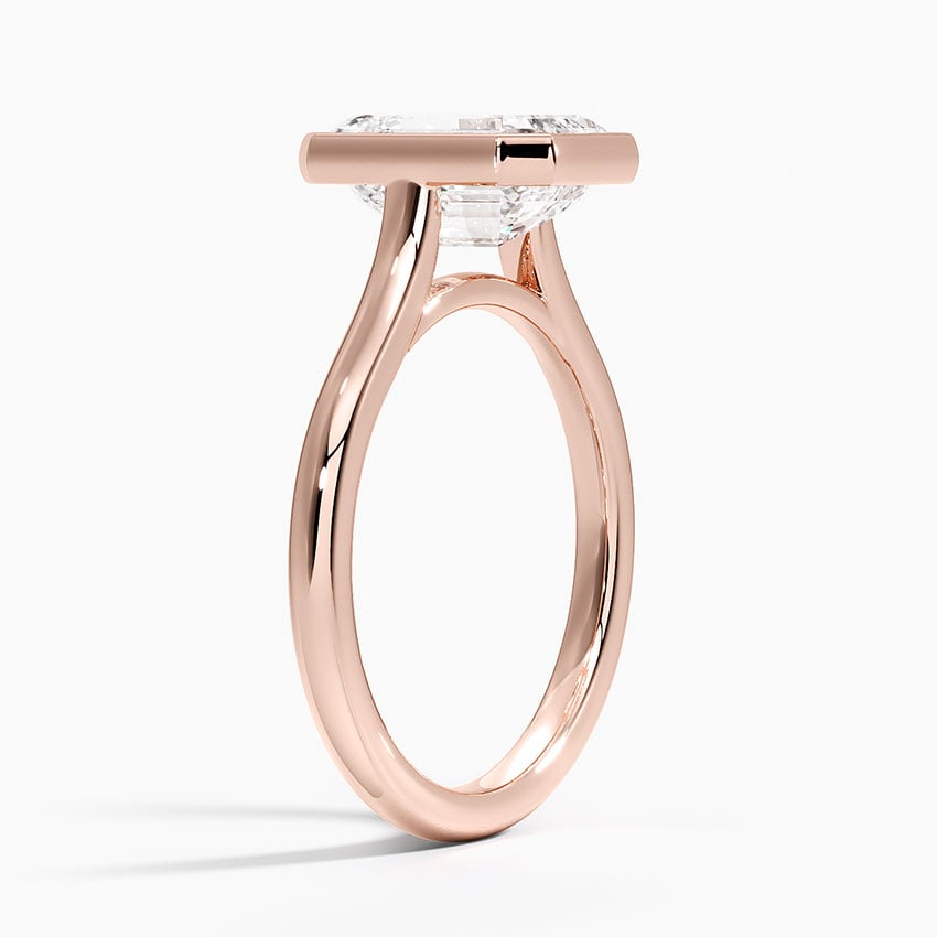 Bezel solitaire engagement ring setting in 14K rose gold, angled side view