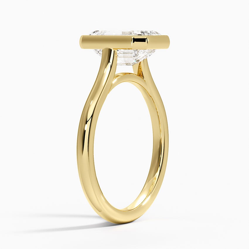 Bezel solitaire engagement ring setting in 14K yellow gold, angled side view