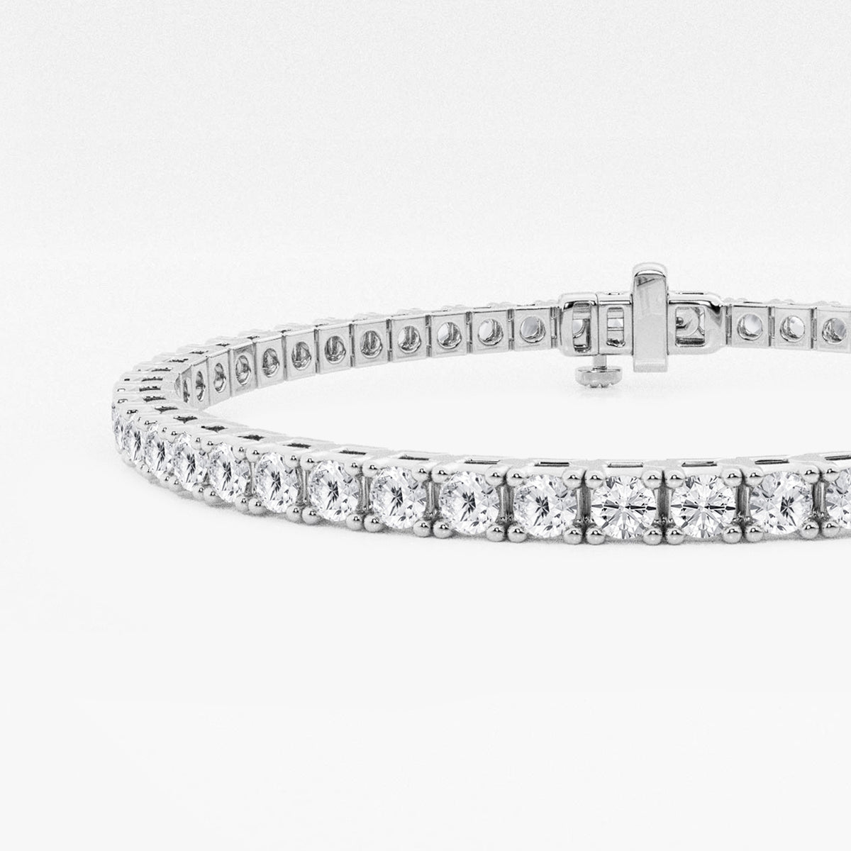 Close-up of four-prong settings and box clasp, 14K white gold tennis bracelet