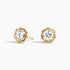 Fleur bezel stud earrings featuring a round lab-grown diamond in a sculpted floral yellow gold setting with screw back closures.