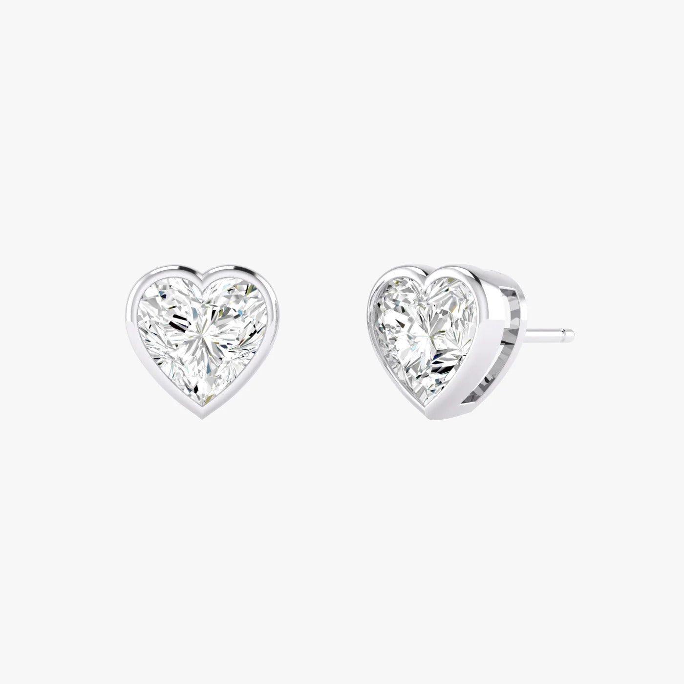 Pair of white gold lab-grown diamond heart stud earrings featuring romantic heart diamond in prong mount, front view, radiant minimalist luxury jewelry