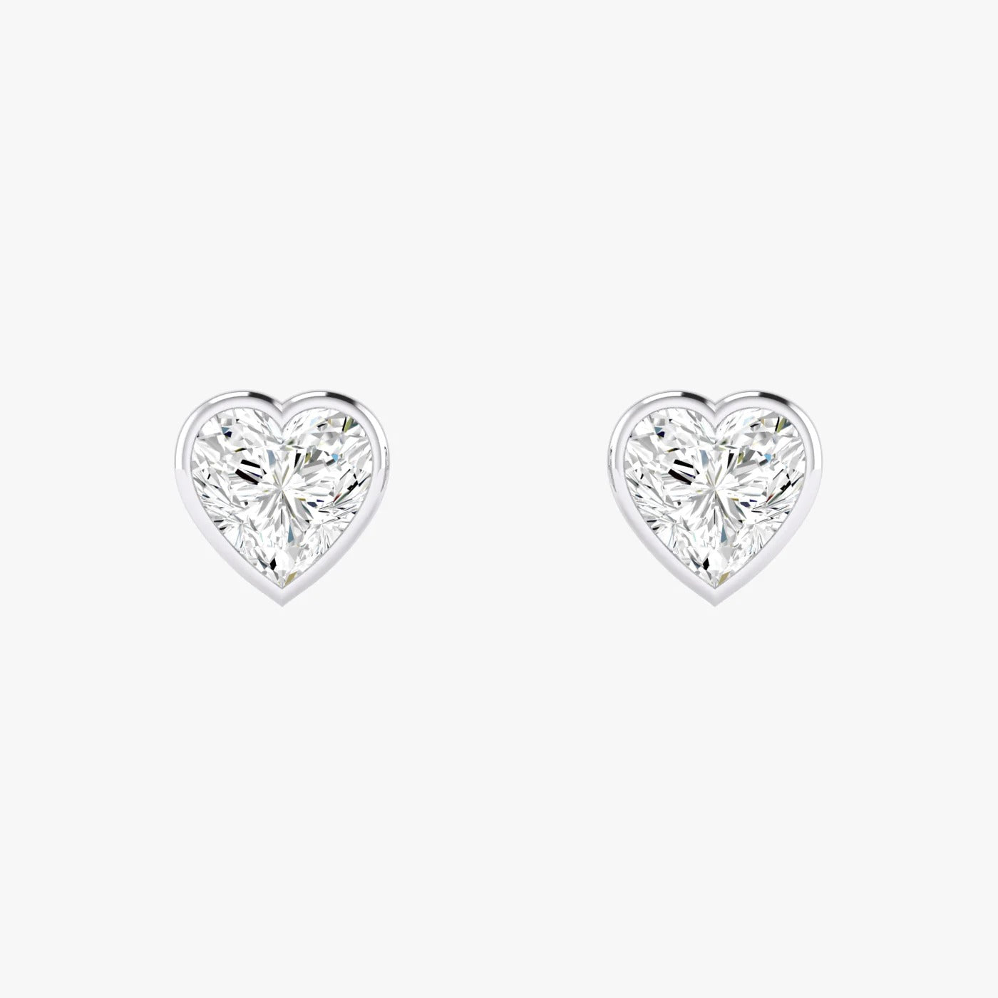 Pair of white gold lab-grown diamond heart stud earrings with single heart-shaped diamond in classic setting, front view, sophisticated timeless jewelry
