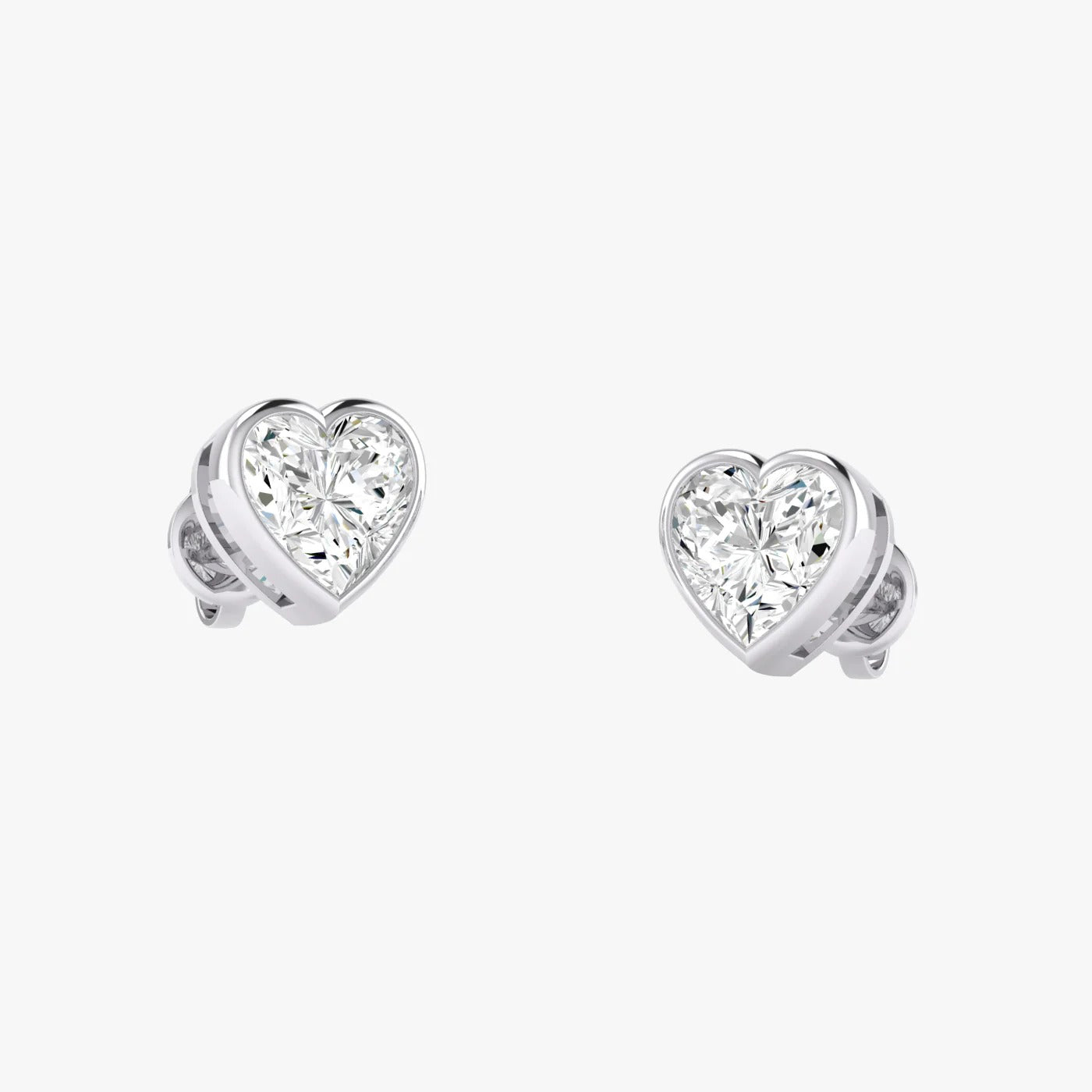 Angled perspective of white gold lab-grown diamond heart earrings with sparkling heart cut stone, pair displayed, elegant bridal diamond studs