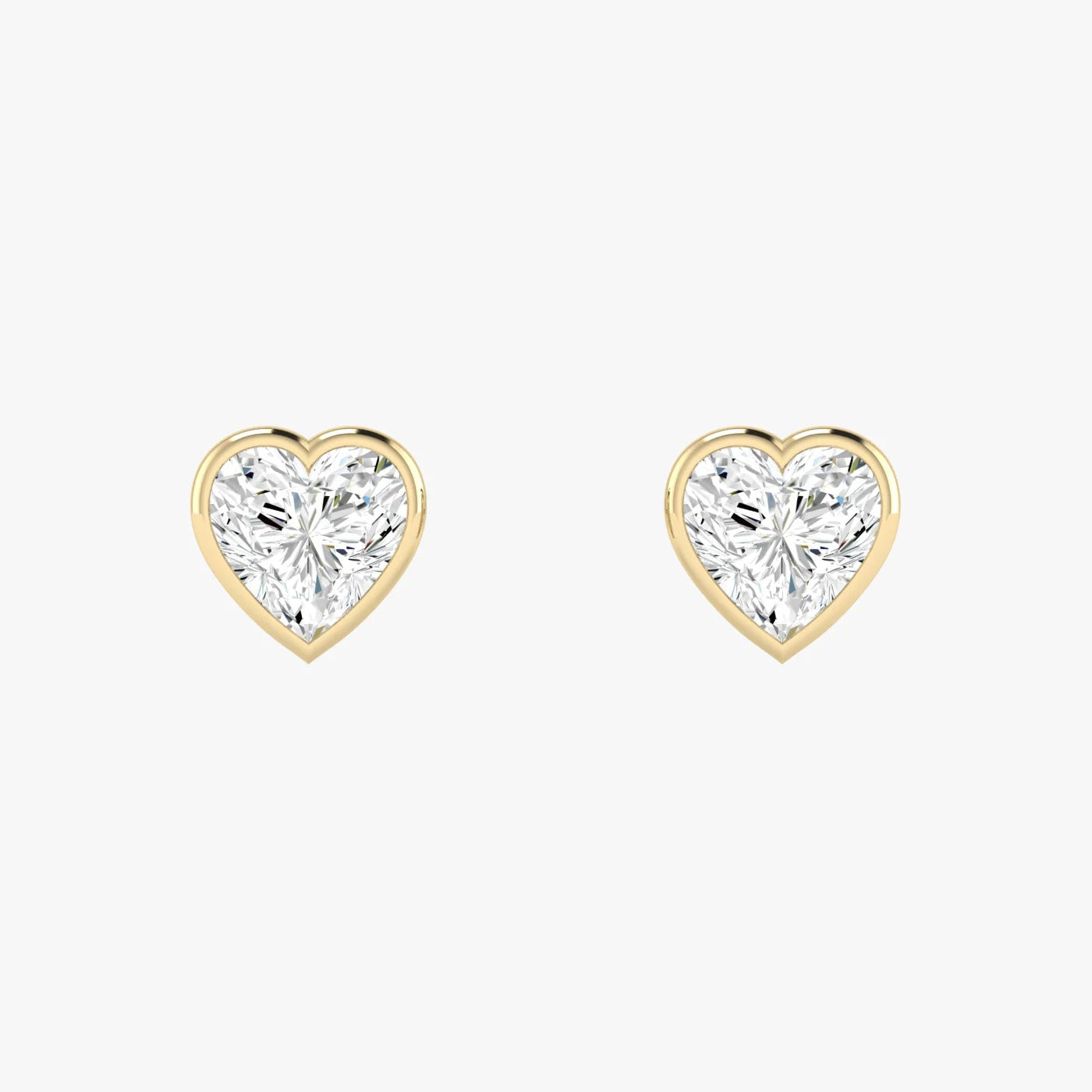 Pair of yellow gold lab-grown diamond heart stud earrings with single romantic heart-cut diamond in elegant prong setting, front view, luxury solitaire diamond jewelry