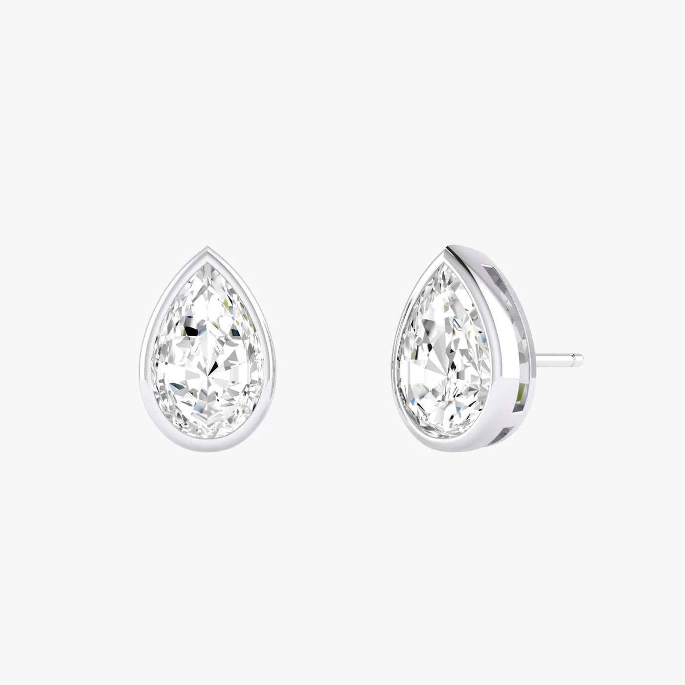 Pair of white gold lab-grown diamond pear stud earrings featuring pointed pear diamond in prong mount, front view, radiant minimalist luxury jewelry