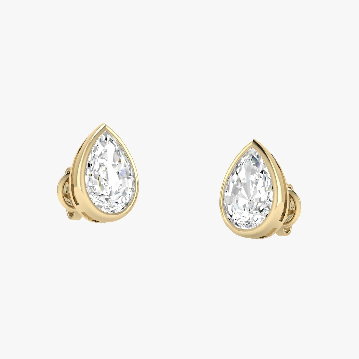 Model wearing yellow gold lab-grown diamond pear stud earrings on ear, side profile view, sparkling teardrop diamond design, elegant classic studs