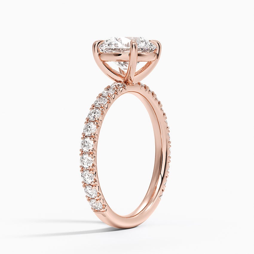 Pavé engagement ring setting in 14K rose gold, angled side view
