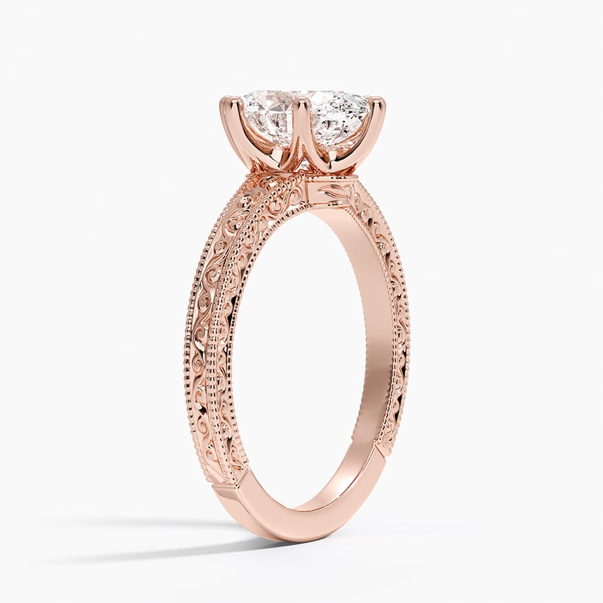 Pavé engagement ring setting in 14K rose gold, angled side view