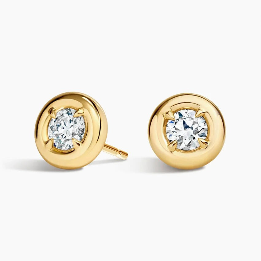 Yellow gold Solenne studs top view, lab grown round brilliant diamond in a smooth domed bezel setting