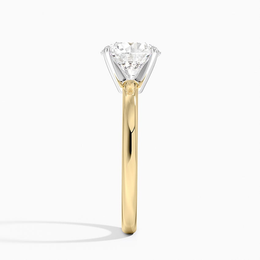 Solitaire engagement ring setting in 14K yellow gold, profile view