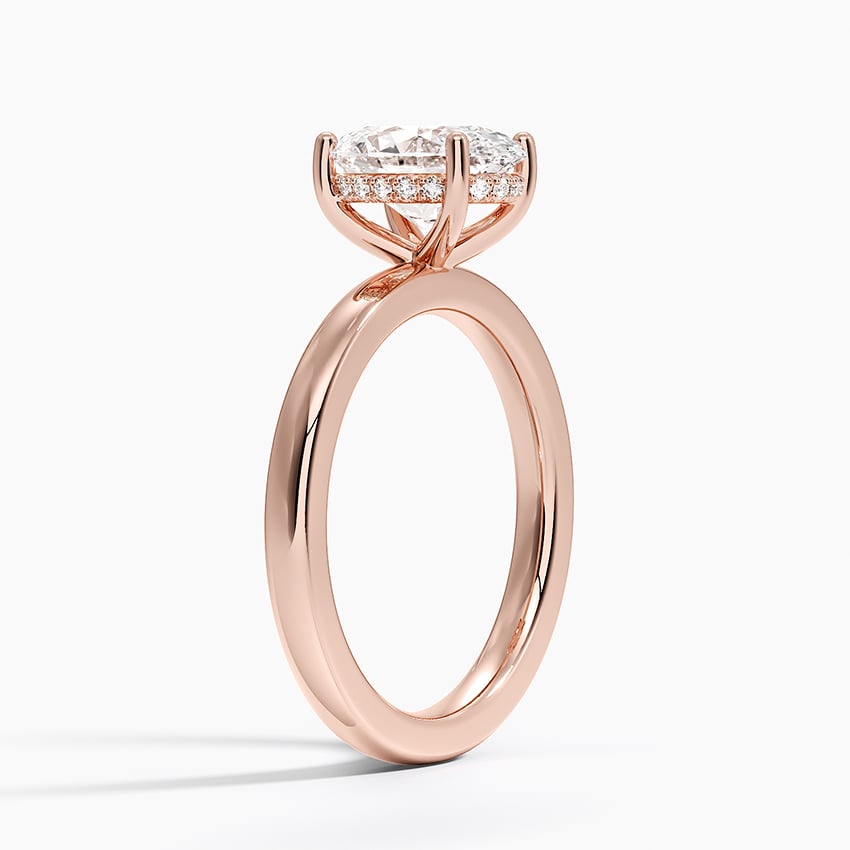 Solitaire engagement ring setting in 14K rose gold, angled side view